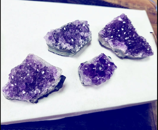 Photo of four amethyst crystals