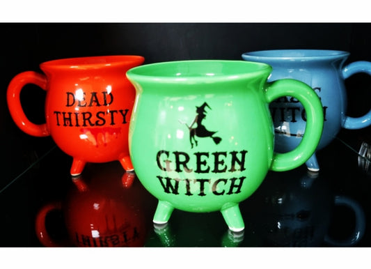 Photo of a two different mugs. One is red with the text Dead Thirsty, one green with the text Green Witch.