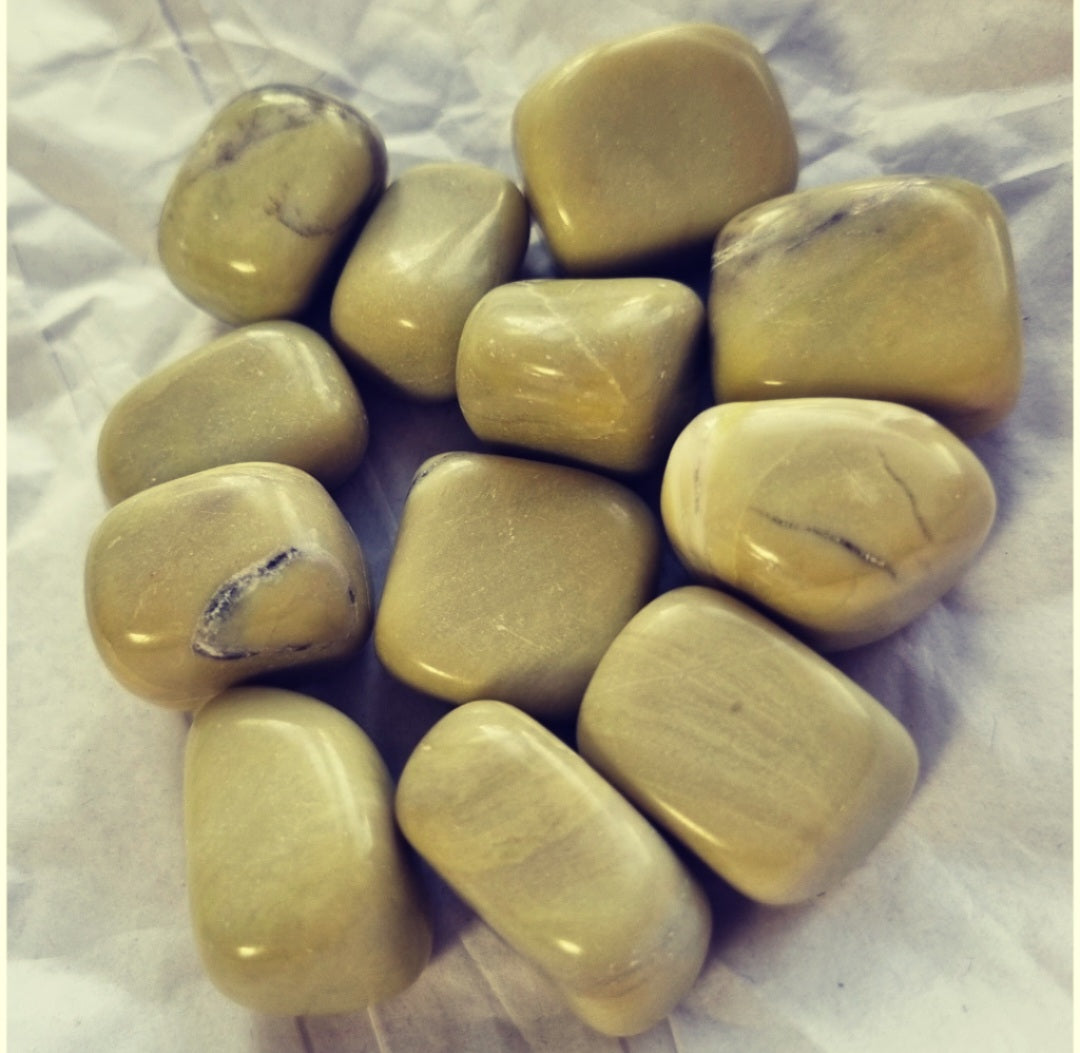 Photo of several jade olive tumblestones