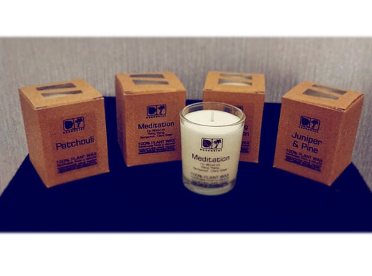 Photo of four boxed candles with one unboxed candle - titled Meditation on the label - on show