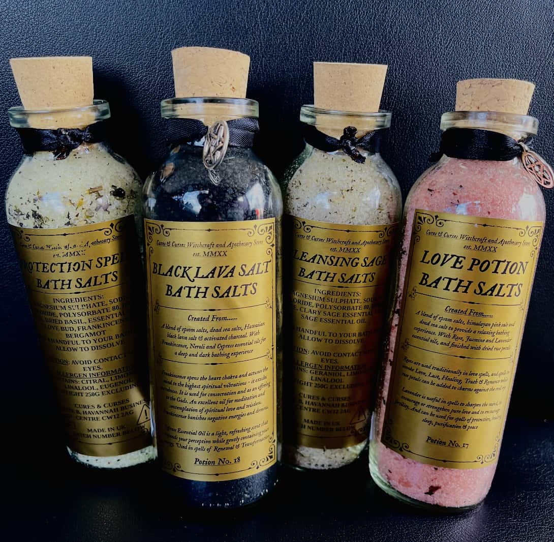 Photo of four bottles of bath salts, labelled protection, black lava, cleansing and love potion.