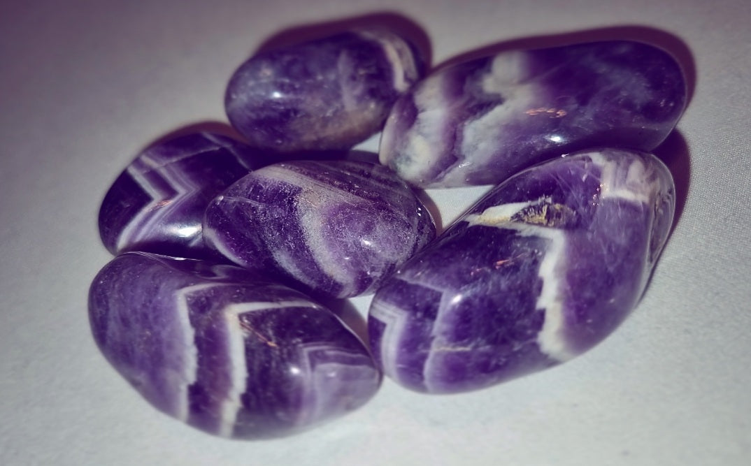 Photo of six amethyst stones