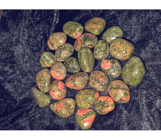 Photo of a number of unakite tumblestones.