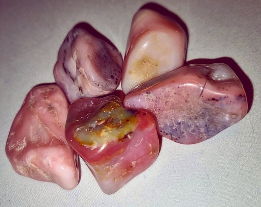 Photo of five pink opal stones