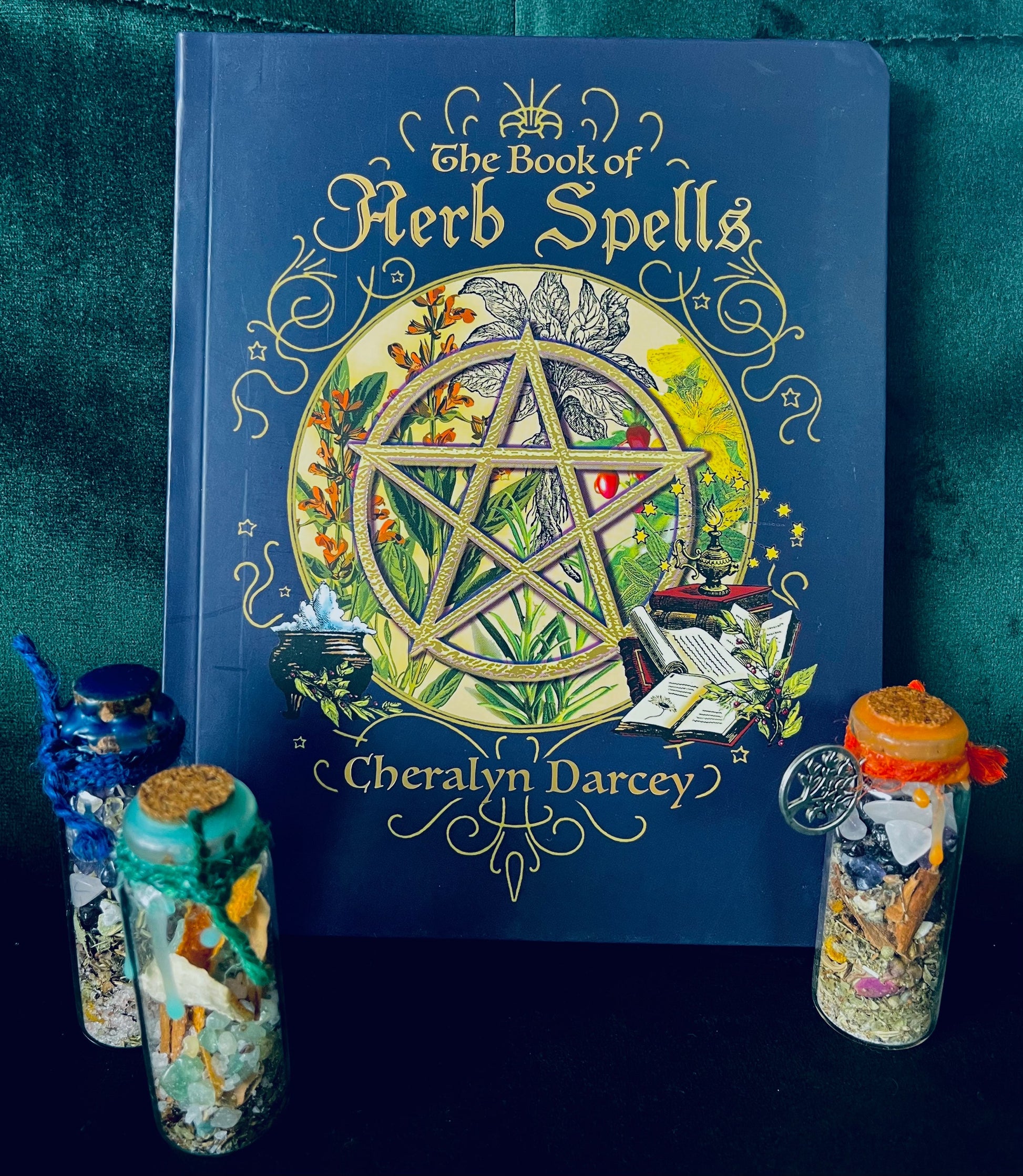 Photo is the book cover for The Book of Herb Spells by Cheralyn Darcey