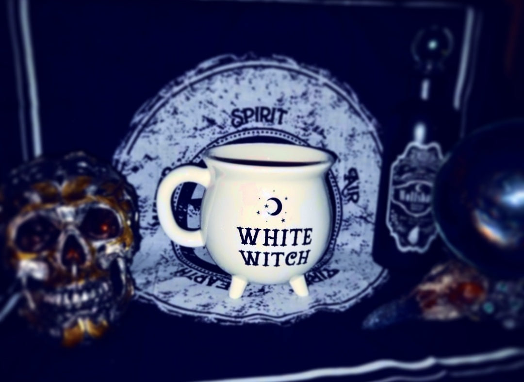 Photo of a white cauldron-shaped mug with the words "Witch Witch" in black